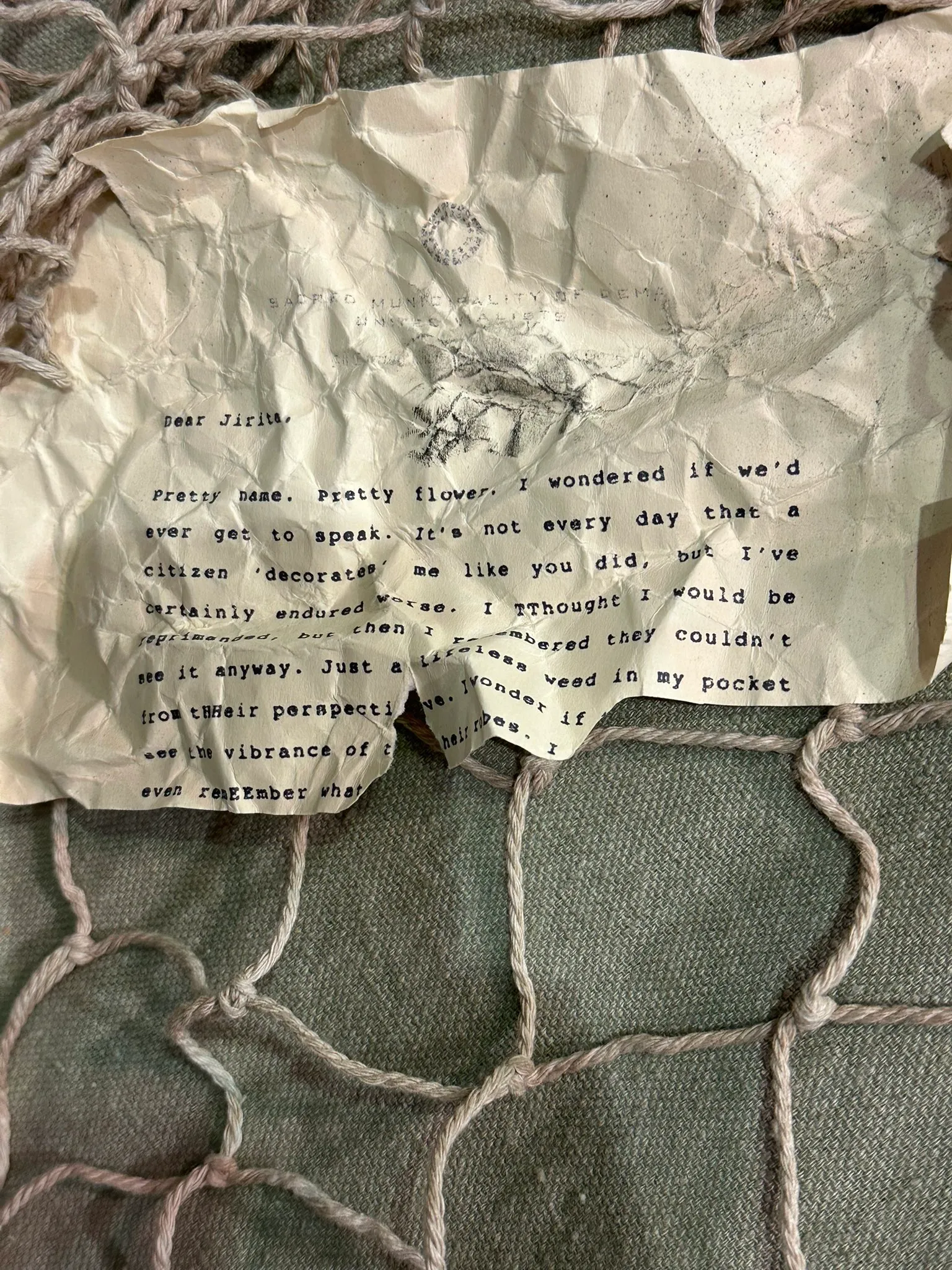 Dear Jirita,

Pretty name. Pretty flower. I wondered if we'd ever get to speak. It's not every day that a citizen 'decorates' me like you did, but I've certainly endured worse. I TThought I would be reprimanded, but then I remembered they couldn't see it anyway. Just a lifeless weed in my pocket from tHHeir perspective. I wonder if [...] see the vibrance of their robes. I [...] even remEEmber what [...]